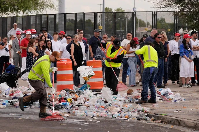 workers-rake-trash-outside-state-farm-stadium-as-a-memorial-service-for-slain-conservative-commentator-charlie-kirk-takes-place